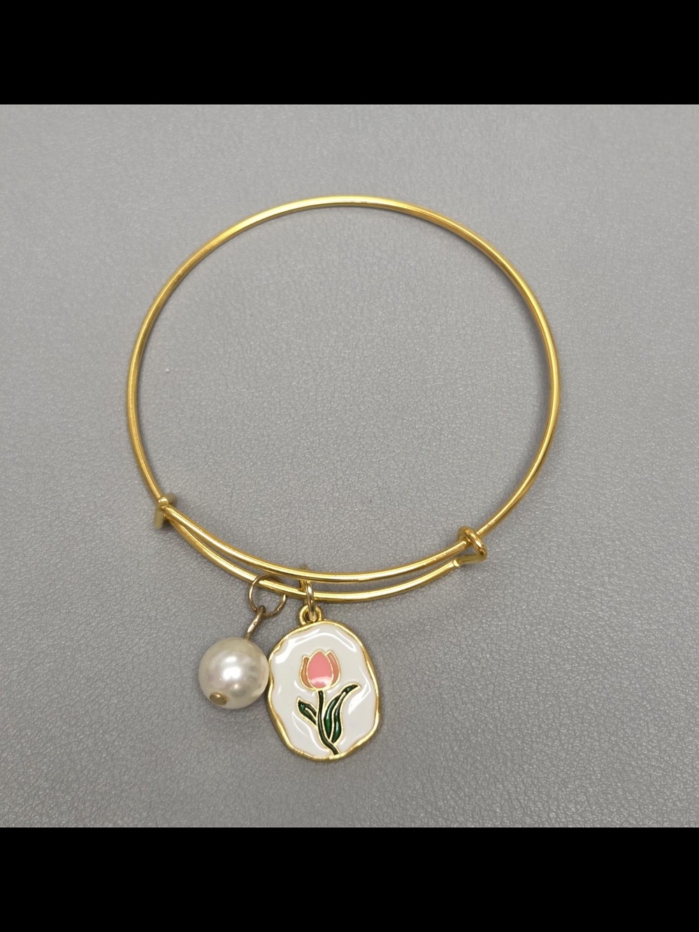 Gold-Tone Bangle Bracelet with Pink Tulip Charm and Pearl